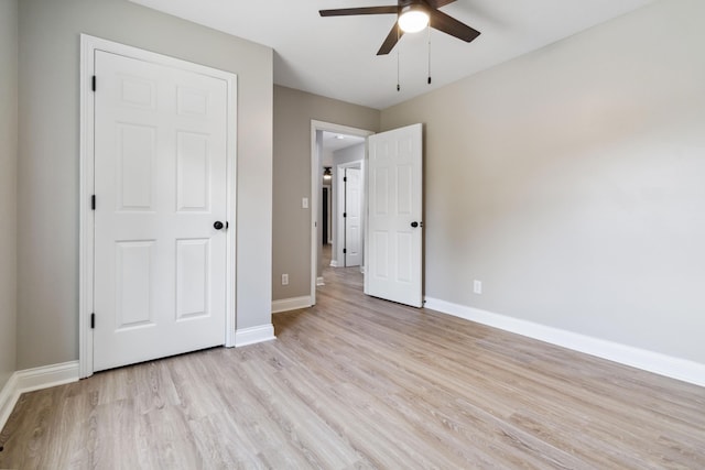 56 Hopewell Church Rd, Corbin, KY 40701 - unfurnished bedroom featuring light wood-style flooring, baseboards, and ceiling fan
