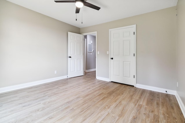 56 Hopewell Church Rd, Corbin, KY 40701 - unfurnished bedroom featuring light wood-style flooring, baseboards, and a ceiling fan