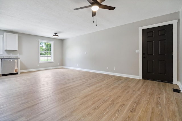 56 Hopewell Church Rd, Corbin, KY 40701 - unfurnished living room featuring a ceiling fan, light wood-style flooring, and baseboards
