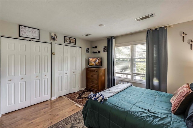 3471 Pimlico Pkwy Unit B, Lexington, KY 40517 - bedroom featuring two closets and light wood-type flooring