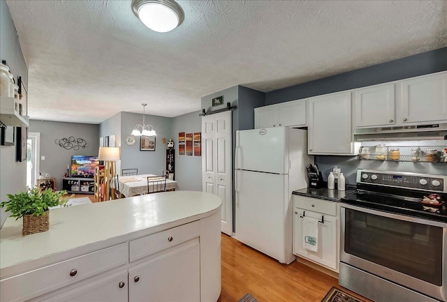 3471 Pimlico Pkwy Unit B, Lexington, KY 40517 - kitchen with stainless steel electric range oven, freestanding refrigerator, under cabinet range hood, a barn door, and light wood-style floors