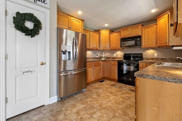 468 Whisper Woods Dr, Somerset, KY 42503 - kitchen featuring black appliances, recessed lighting, dark countertops, a textured ceiling, and light tile patterned floors