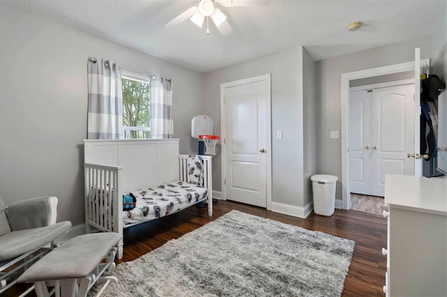 468 Whisper Woods Dr, Somerset, KY 42503 - bedroom with dark wood finished floors, ceiling fan, and a textured ceiling