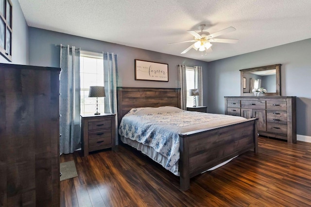 468 Whisper Woods Dr, Somerset, KY 42503 - bedroom with dark wood-type flooring, multiple windows, a textured ceiling, and a ceiling fan
