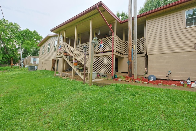 2858 Ford Hampton Rd, Winchester, KY 40391 - rear view of house with central AC, a lawn, and stairway