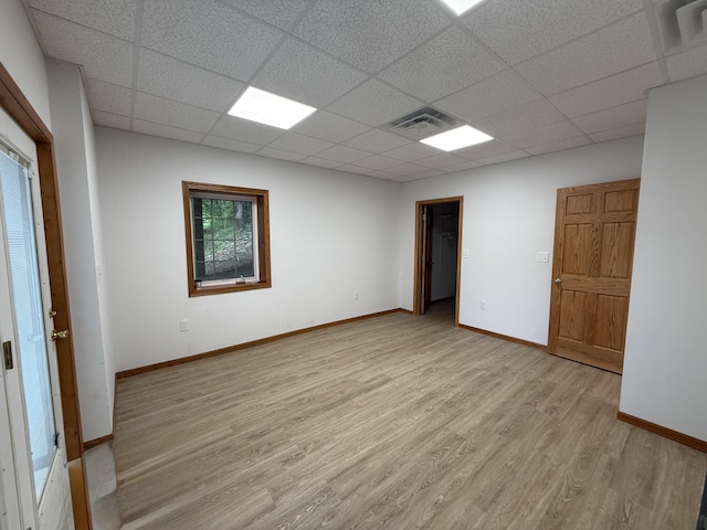 1090 Laurel Cove Rd, London, KY 40744 - empty room featuring a paneled ceiling, light wood-style floors, and baseboards