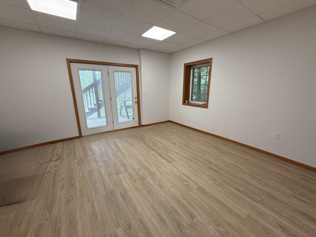 1090 Laurel Cove Rd, London, KY 40744 - unfurnished room with a drop ceiling, light wood-type flooring, and baseboards