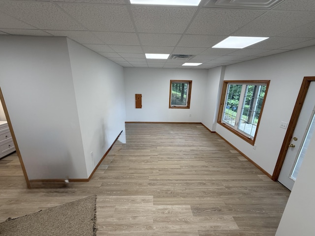 1090 Laurel Cove Rd, London, KY 40744 - empty room featuring a drop ceiling, wood finished floors, and baseboards