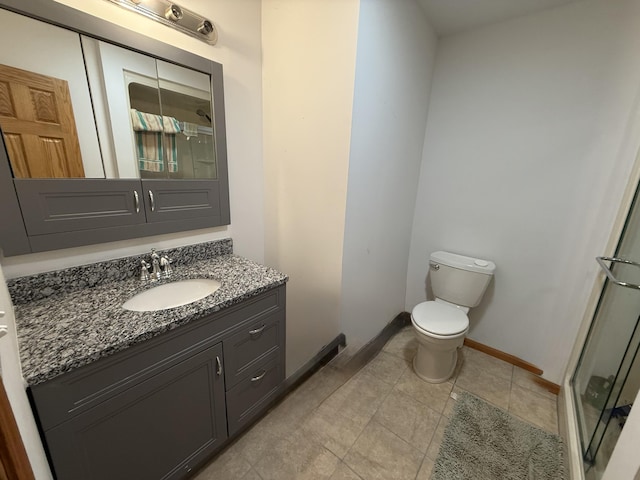 1090 Laurel Cove Rd, London, KY 40744 - full bathroom with vanity, a stall shower, toilet, baseboards, and tile patterned floors