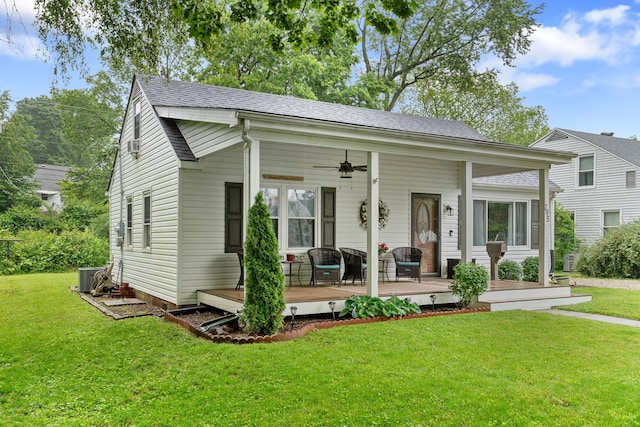 795 Allendale Dr, Lexington, KY 40503 - bungalow-style home featuring a ceiling fan, a front yard, cooling unit, roof with shingles, and a wooden deck