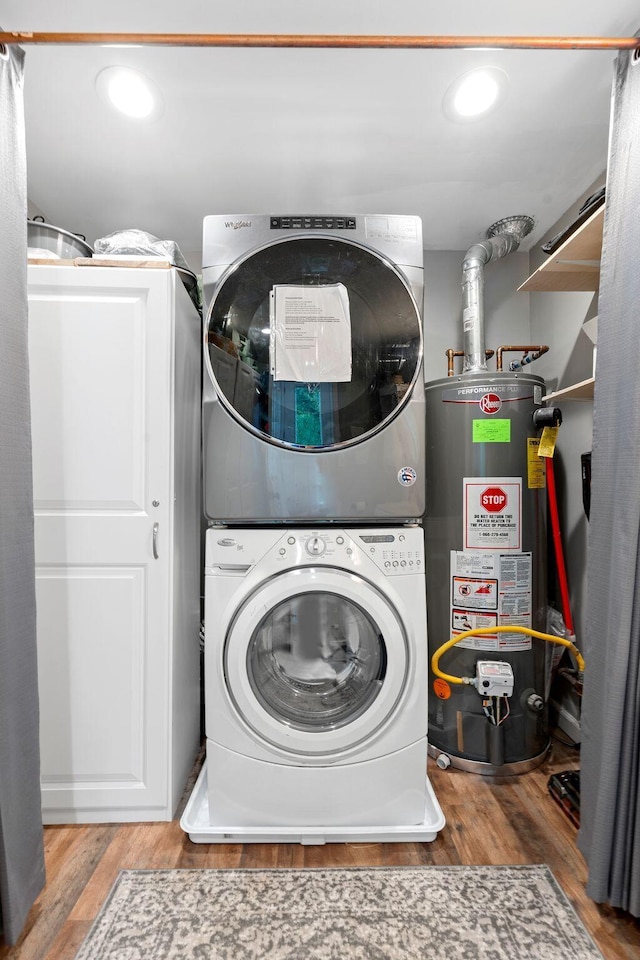 795 Allendale Dr, Lexington, KY 40503 - laundry room with estacked washer and dryer, gas water heater, and wood finished floors