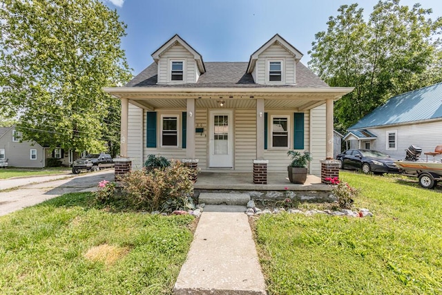 100 Mcdonald St, Nicholasville, KY 40356 - view of front facade featuring covered porch, a front yard, and roof with shingles
