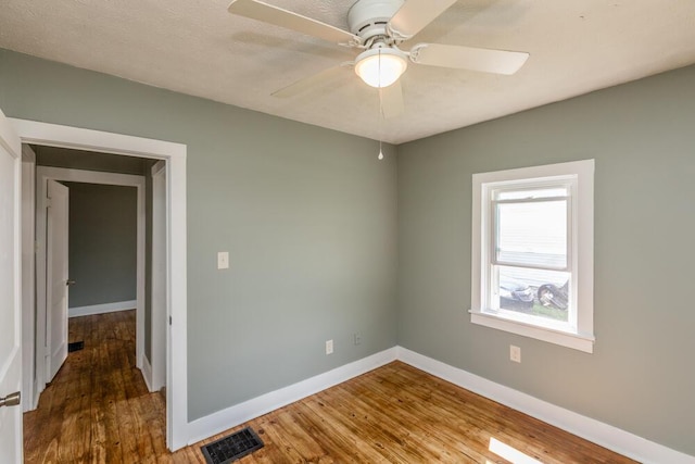 100 Mcdonald St, Nicholasville, KY 40356 - empty room with baseboards, wood finished floors, and ceiling fan