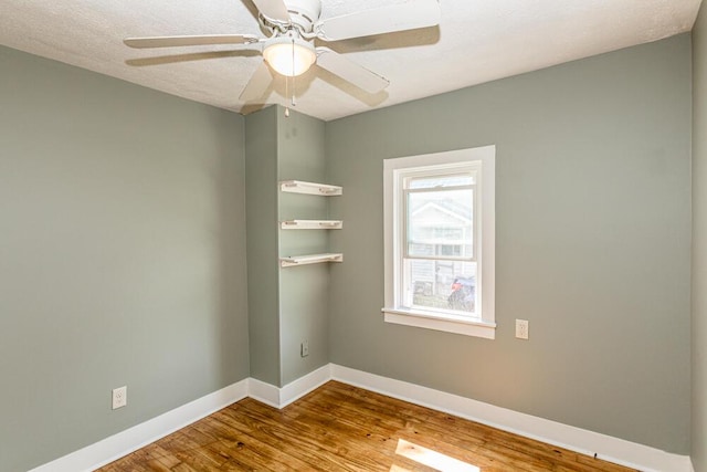 100 Mcdonald St, Nicholasville, KY 40356 - empty room featuring wood finished floors, baseboards, and ceiling fan