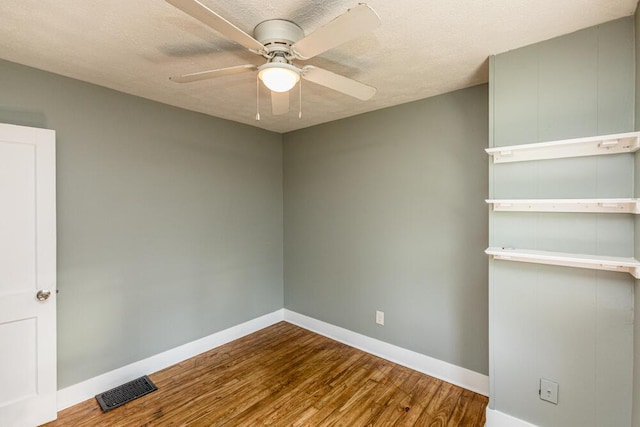 100 Mcdonald St, Nicholasville, KY 40356 - spare room featuring baseboards, a ceiling fan, and wood finished floors
