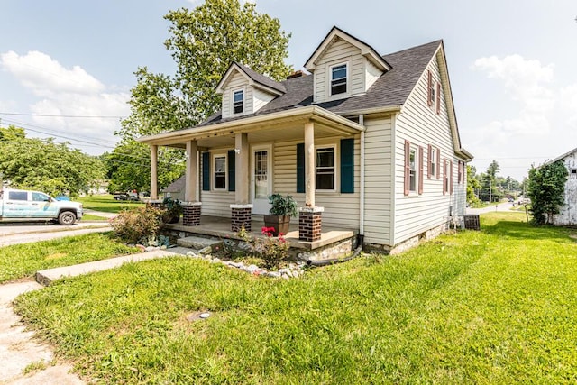 100 Mcdonald St, Nicholasville, KY 40356 - cape cod house featuring a porch, a front yard, and roof with shingles