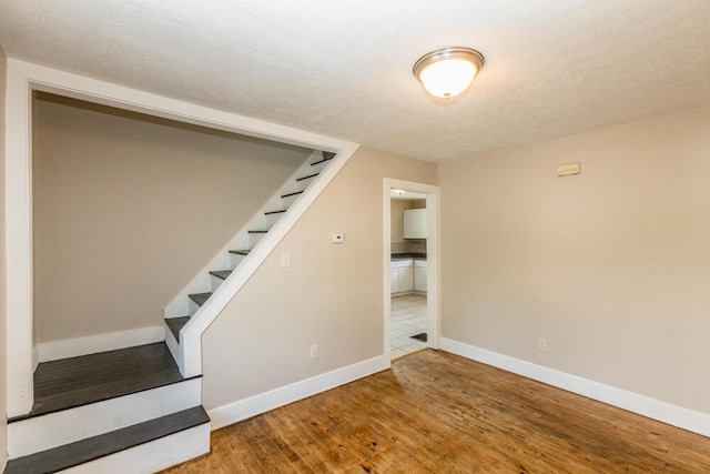 100 Mcdonald St, Nicholasville, KY 40356 - basement featuring baseboards, wood finished floors, and stairway