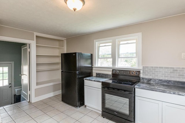 100 Mcdonald St, Nicholasville, KY 40356 - kitchen with black appliances, white cabinets, dark countertops, and light tile patterned floors