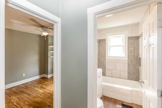 100 Mcdonald St, Nicholasville, KY 40356 - bathroom featuring wood finished floors, ceiling fan, shower / bath combination, vanity, and baseboards