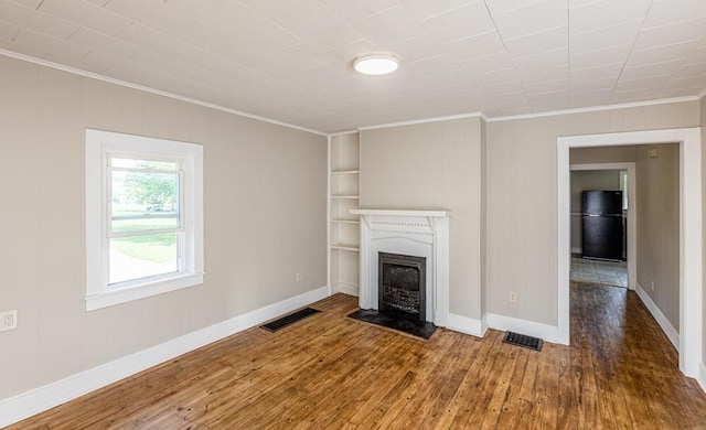100 Mcdonald St, Nicholasville, KY 40356 - unfurnished living room featuring crown molding, wood-type flooring, a fireplace, and baseboards