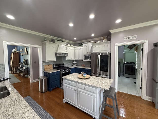 1404 Clubhouse Ln, Mt Sterling, KY 40353 - kitchen featuring stainless steel appliances, premium range hood, blue cabinetry, crown molding, and white cabinets