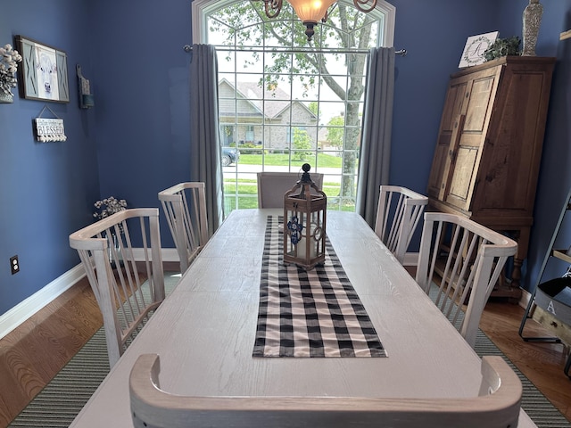 1404 Clubhouse Ln, Mt Sterling, KY 40353 - dining area featuring wood finished floors, baseboards, and a chandelier