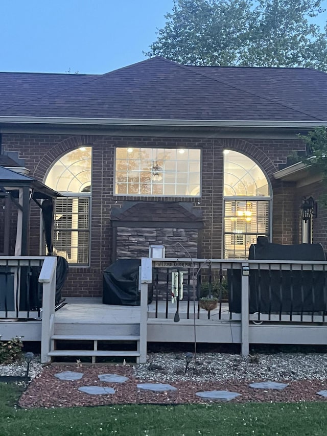 1404 Clubhouse Ln, Mt Sterling, KY 40353 - rear view of house featuring brick siding, a shingled roof, and a deck