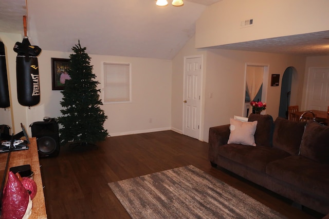 557 Chestnut St, Lexington, KY 40508 - living room featuring arched walkways, wood finished floors, baseboards, and lofted ceiling