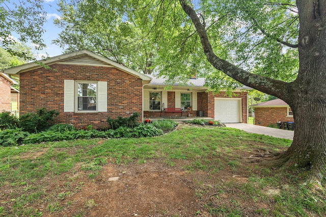 1128 Kiowa Trl, Frankfort, KY 40601 - ranch-style home featuring brick siding, driveway, an attached garage, and a front yard