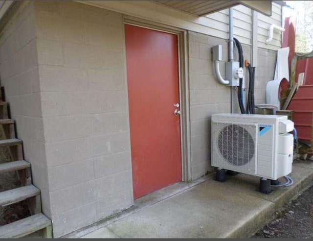 130 Morgan View Rd, Wellington, KY 40387 - property entrance featuring ac unit and concrete block siding