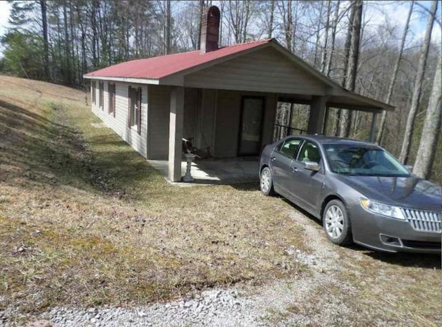 130 Morgan View Rd, Wellington, KY 40387 - view of side of property with a carport, a chimney, and metal roof