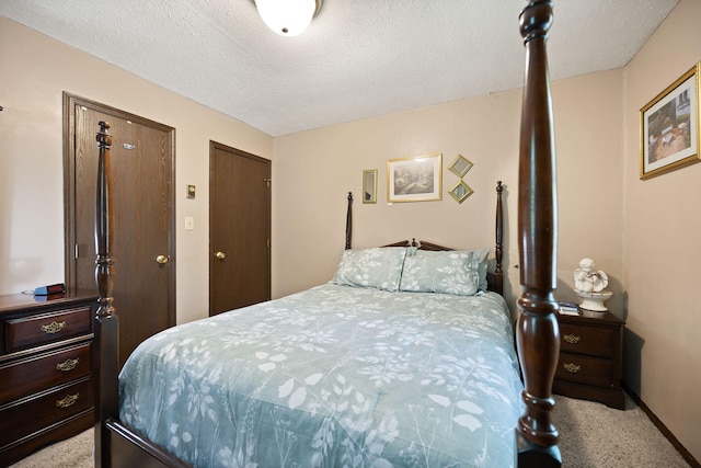 600 Tug Branch Rd, Clay City, KY 40312 - bedroom featuring light colored carpet, a textured ceiling, and multiple closets