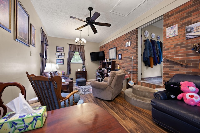 600 Tug Branch Rd, Clay City, KY 40312 - living room featuring wood finished floors, brick wall, a textured ceiling, and a ceiling fan