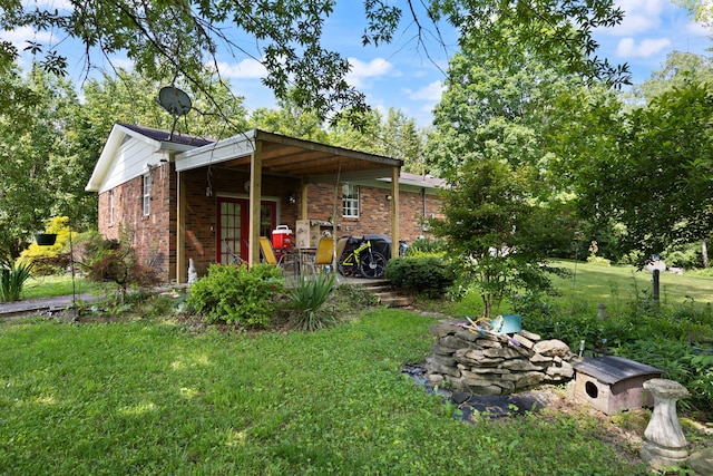 600 Tug Branch Rd, Clay City, KY 40312 - rear view of property featuring brick siding and a lawn