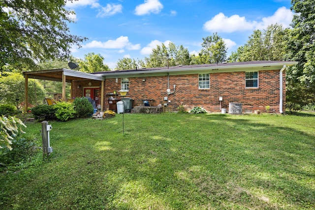 600 Tug Branch Rd, Clay City, KY 40312 - rear view of property featuring brick siding, a lawn, and cooling unit