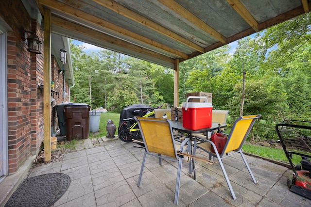 600 Tug Branch Rd, Clay City, KY 40312 - view of patio / terrace with outdoor dining area and view of wooded area