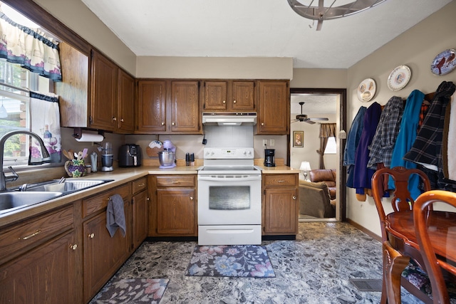 600 Tug Branch Rd, Clay City, KY 40312 - kitchen featuring white range with electric cooktop, under cabinet range hood, a sink, light countertops, and brown cabinets