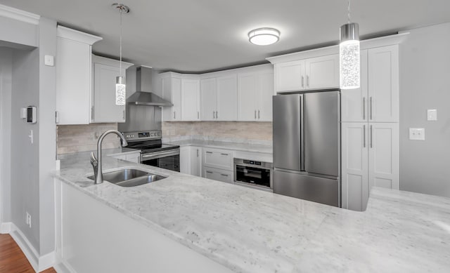 244 Chippendale Cir, Lexington, KY 40517 - kitchen featuring appliances with stainless steel finishes, wall chimney exhaust hood, a sink, and light stone counters