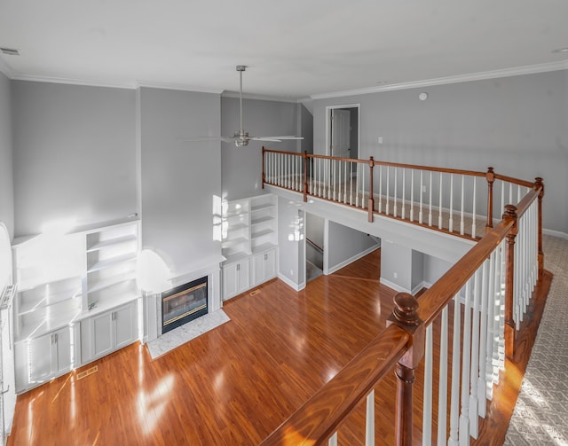 244 Chippendale Cir, Lexington, KY 40517 - unfurnished living room with crown molding, ceiling fan, wood finished floors, a high end fireplace, and baseboards