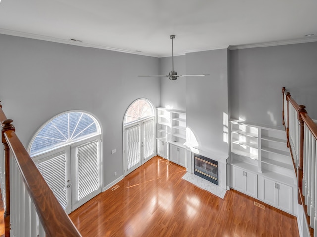 244 Chippendale Cir, Lexington, KY 40517 - unfurnished living room featuring wood finished floors, stairs, crown molding, a fireplace, and ceiling fan