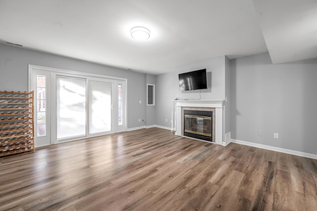 244 Chippendale Cir, Lexington, KY 40517 - unfurnished living room with a tiled fireplace, wood finished floors, and baseboards
