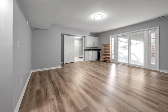244 Chippendale Cir, Lexington, KY 40517 - unfurnished living room featuring baseboards and light wood-style flooring