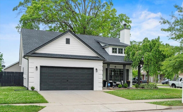 588 E Fifth St, Lexington, KY 40508 - view of front of property featuring a garage, a shingled roof, a porch, concrete driveway, and a chimney