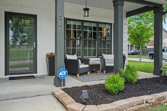 588 E Fifth St, Lexington, KY 40508 - view of exterior entry featuring a porch and brick siding