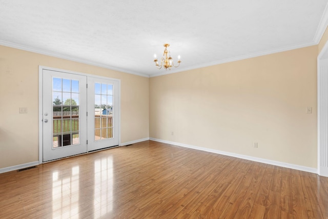 174 Shirdell Dr, Richmond, KY 40475 - unfurnished room featuring a chandelier, wood finished floors, baseboards, and ornamental molding