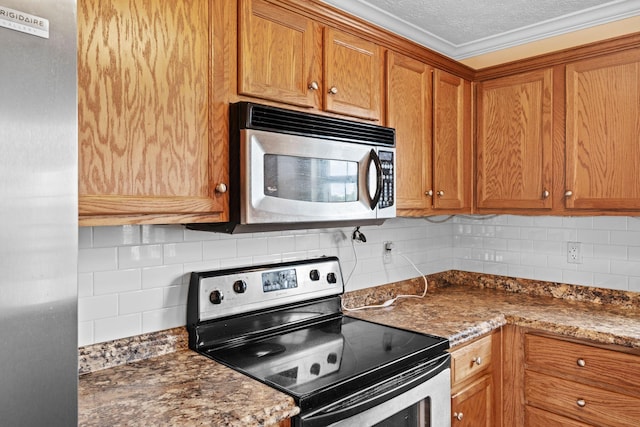 174 Shirdell Dr, Richmond, KY 40475 - kitchen with stainless steel appliances, backsplash, and brown cabinetry
