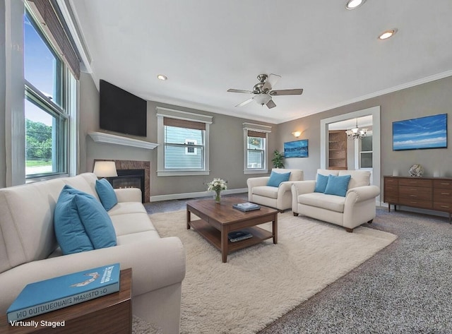 213 W Elm St, Nicholasville, KY 40356 - living room featuring ornamental molding, carpet, a chandelier, a fireplace, and a ceiling fan