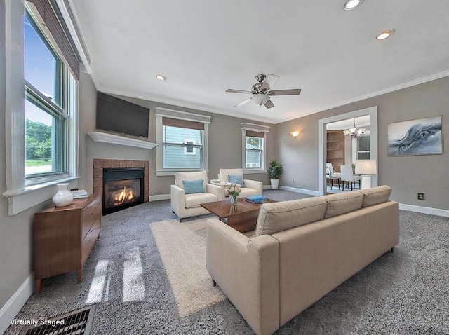 213 W Elm St, Nicholasville, KY 40356 - carpeted living area featuring crown molding, baseboards, a tiled fireplace, a chandelier, and recessed lighting