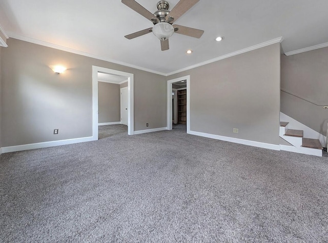 213 W Elm St, Nicholasville, KY 40356 - unfurnished bedroom with ornamental molding, a walk in closet, baseboards, carpet flooring, and recessed lighting