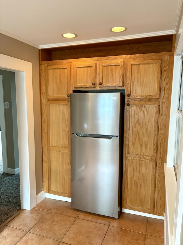 213 W Elm St, Nicholasville, KY 40356 - kitchen featuring freestanding refrigerator, light tile patterned floors, recessed lighting, and crown molding